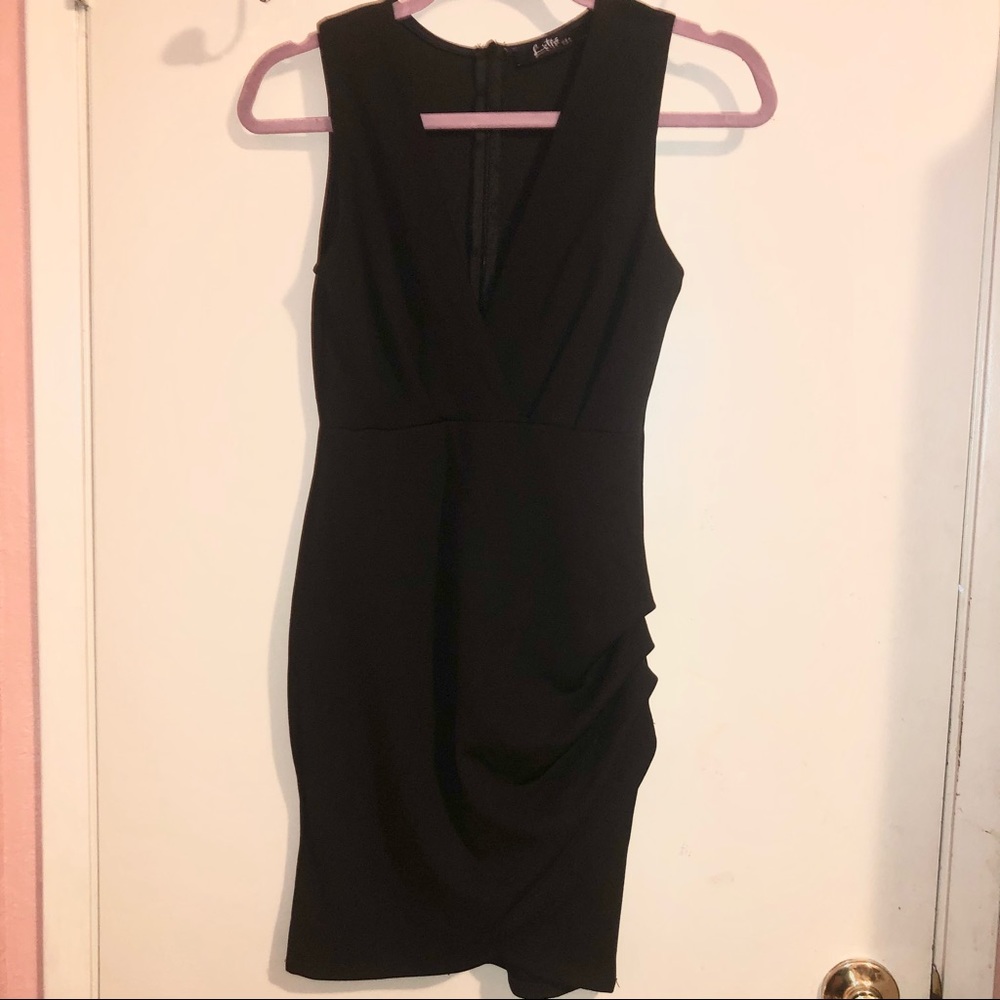 Lette Black Dress with a Ruffle